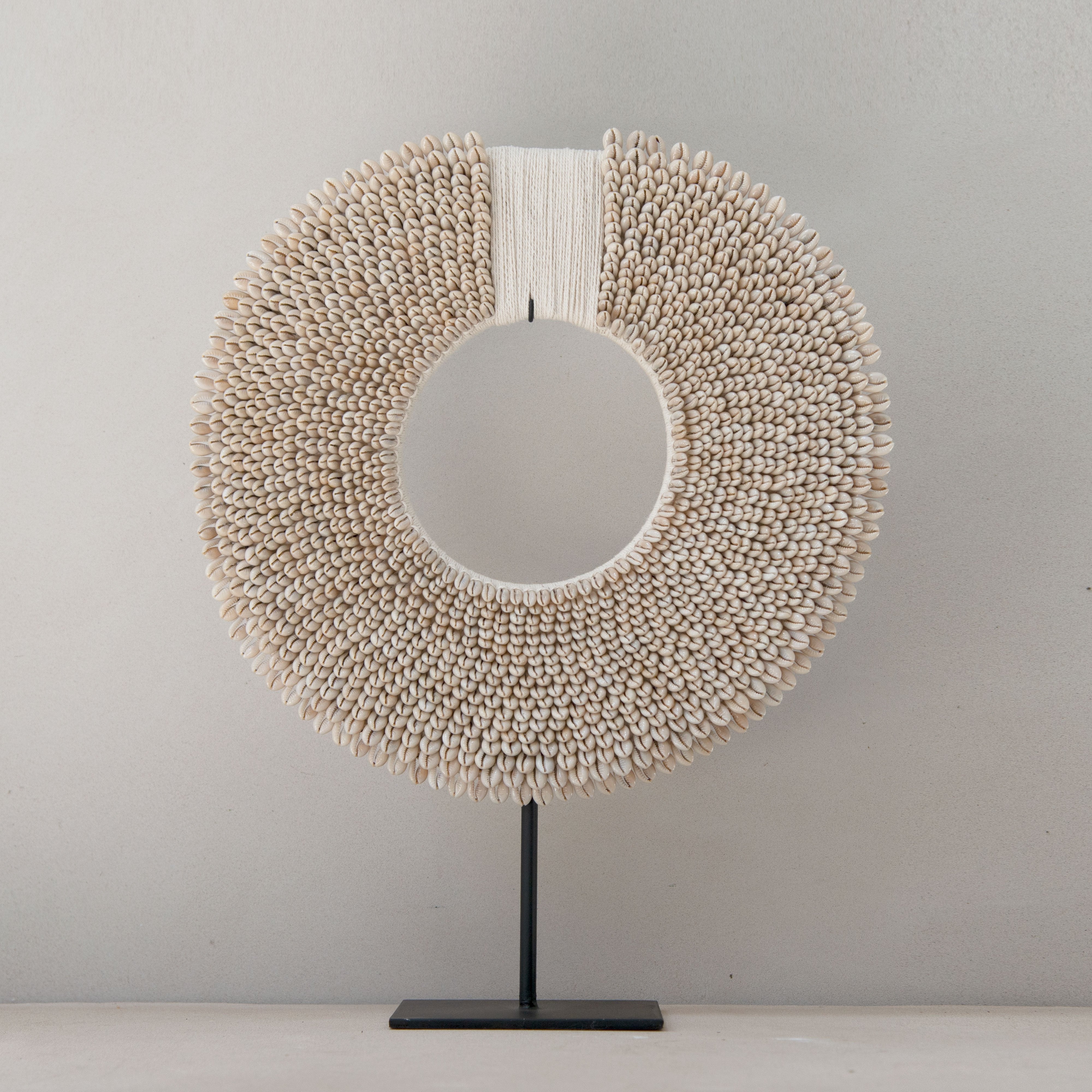 Cowrie shell necklace on stand store